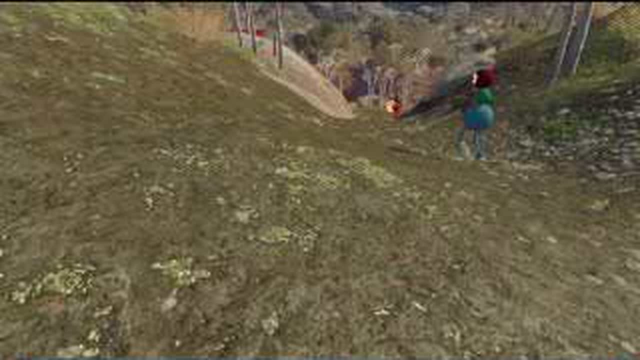 Team carrying the green-scaffold red figurine down the BIG WALK cliff