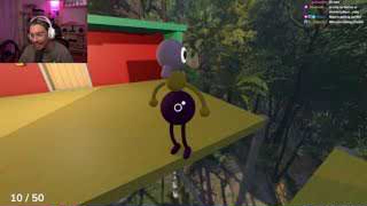 Players stacking to cross the first wall of the BIG WALK obstacle course