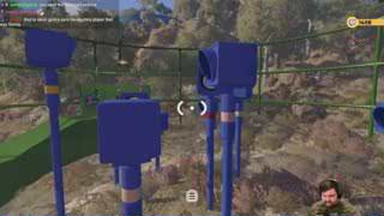 Green BIG WALK head-count arena with ten tall blue lamp columns